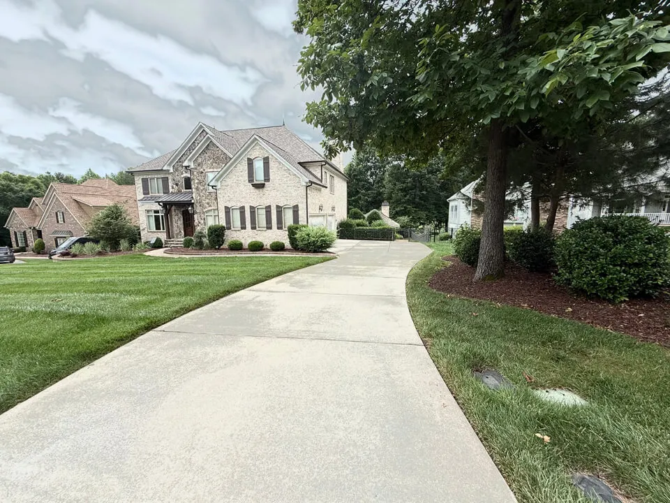 Pressure washed driveway result on a residential property